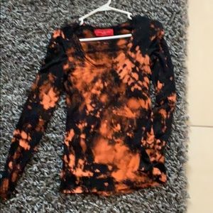 A bleach dyed long sleeve shirt.